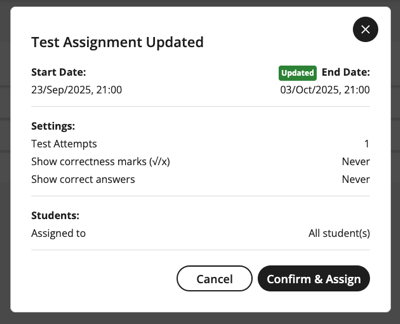 Dialog box titled "Test Assignment Updated" displaying a confirmation message about the new end date and time. Two action buttons-Cancel and Confirm and Assign-are located at the bottom of the dialog box.