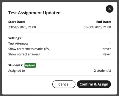 Dialog box titled "Test Assignment Update" displaying a confirmation message about updated student assignment. Two action buttons-Cancel and Confirm and Assign-are located at the bottom of the dialog.